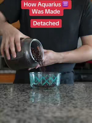 A person is pouring coffee beans from a clear jar into a clear patterned bowl. Above, text overlays describe the zodiac sign and features of the astrological sign.
