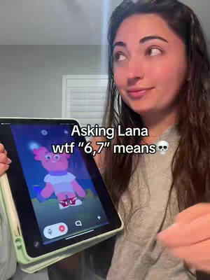 A woman holds a tablet displaying a colorful cartoon image and text overlay. She appears to be in a casual setting.