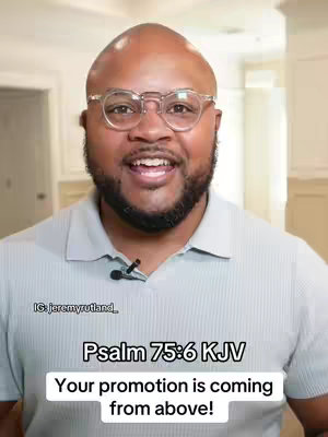 A middle-aged Black man with glasses smiles and speaks directly to the camera. Text overlayed on the image displays a bible verse.
