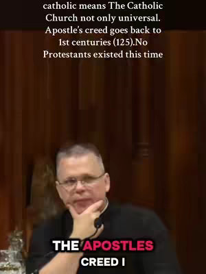A man wearing glasses and a dark top speaks to the camera. Text overlays appear at the top and bottom of the frame, conveying information.