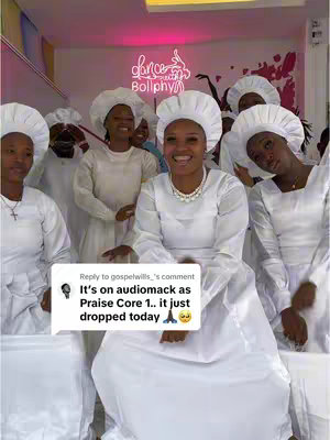 A group of women in white dresses and headwear, smiling. The central figure is in focus. A text bubble on the lower left reveals a comment, overlayed on the image.