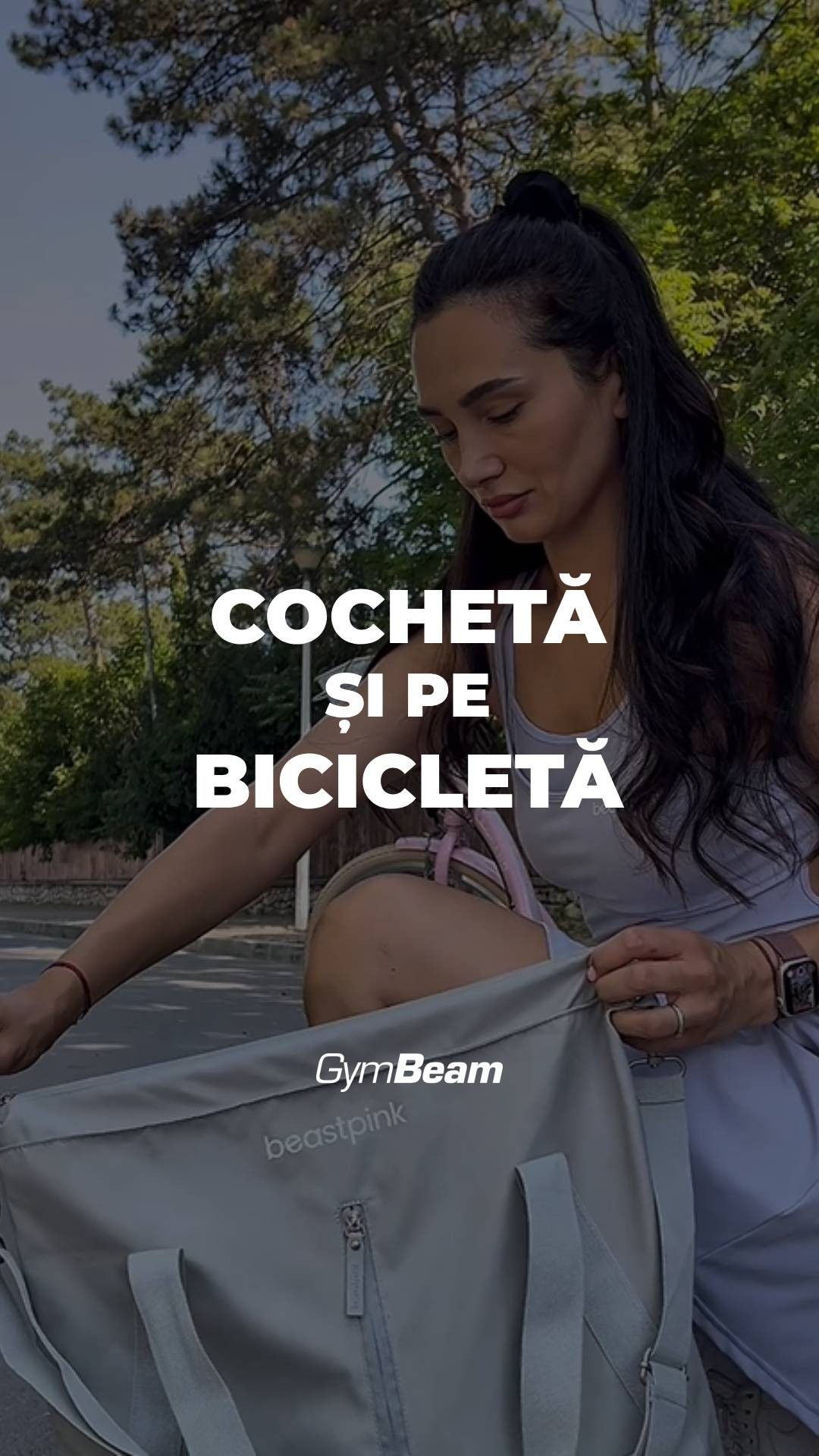 The cover image features a woman holding a gray sports bag, with text overlayed. The woman is facing downwards, and a bicycle is partially visible in the background. The GymBeam and BeastPink logos are also visible.