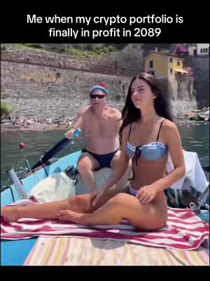 A woman in a blue bikini sits on a boat with a man rowing in the background. Text overlay says 'Me when my crypto portfolio is finally in profit in 2089.'