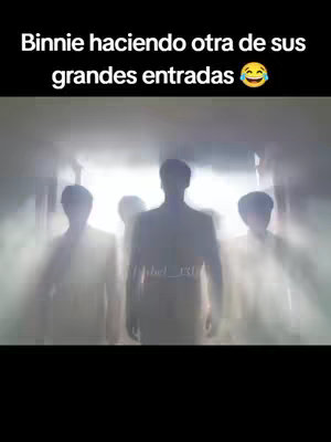The image shows a dark, stylized, cinematic scene. Four silhouetted figures are walking towards the viewer, emerging from a bright, hazy light. The figures are indistinct, with only their basic shapes visible against the bright background. There is visible text at the top with a dark background.