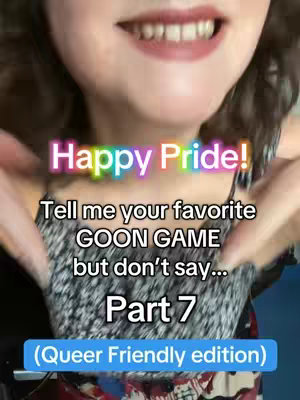 A close-up shot featuring a person's face. Their mouth is visible, with a smile revealing teeth, and the person is holding out their arms. Overlay text in various colors reading "Happy Pride!", "Tell me your favorite GOON GAME but don't say... Part 7", and "(Queer Friendly edition)". The person is wearing a patterned top and has dark curly hair.