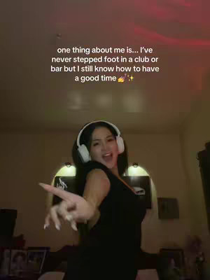 A woman wearing headphones gestures joyfully in a well-lit room. Text overlayed indicates a preference to not go to clubs and bars while still having fun.