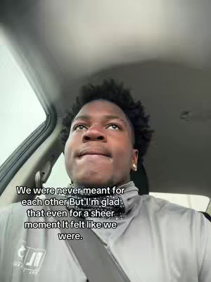 A young Black man is looking upward, his expression pensive, from the driver's seat of a car. Text overlays the image, conveying a wistful sentiment.