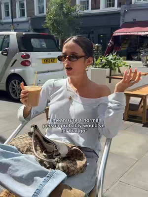 A woman with sunglasses and a light-colored shirt sits outside at a cafe, a drink in hand. Text overlay across the image.