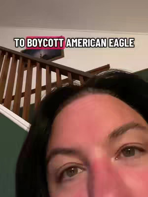 The video shows a close-up of a woman's face, with the top of her head and eyes in view. Above her, the text overlay reads "TO BOYCOTT AMERICAN EAGLE" in a white, bold font, with the background of text in a pink box. 