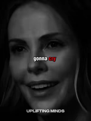 A black and white close-up of a woman's face, with the text 'gonna cry' overlaid on the image. The woman is looking towards the camera, and the lighting highlights her facial features.