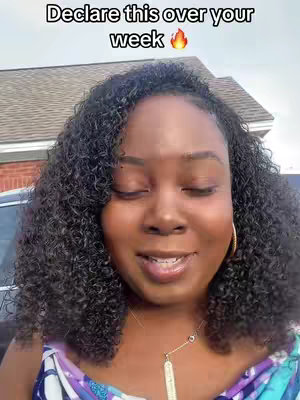 A close-up shot of a Black woman with curly hair against an out-of-focus outdoor background. She is smiling with her eyes closed, a golden necklace is visible, and text overlays the top portion of the image.