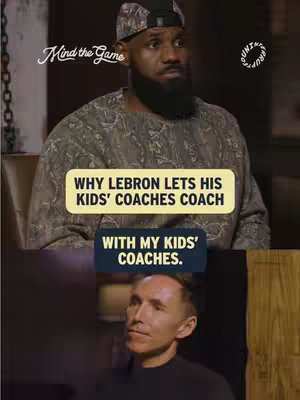The image is a vertical split-screen. The top half features LeBron James in a camouflage cap and shirt, looking slightly off-camera with a serious expression. A text overlay in a yellow rounded rectangle states, 'WHY LEBRON LETS HIS KIDS' COACHES COACH'. A second, smaller blue rounded rectangle with white text reading 'WITH MY KIDS' COACHES.' is positioned beneath it.  The bottom half shows a man in a black shirt looking up thoughtfully.