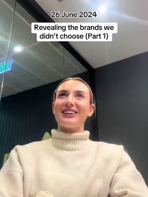 The cover image captures a woman looking up and to the left with a smile and open mouth. The top of the image has the text "26 June 2024" and "Revealing the brands we didn't choose (Part 1)". The background shows a glossy ceiling and a wall with an adjacent dark panel.