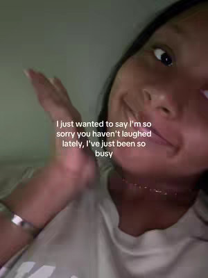 A close-up shot shows a person's face at an angle, with the focus on their eye. Text overlayed on the image conveys a message about apologies and being busy, while the person seems to be holding up their fingers to emphasize the message.