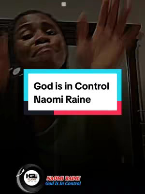 The cover image shows a woman with a distressed expression and hands raised in a worshipful gesture. Overlayed is a text box with the title "God is in Control" and the name "Naomi Raine", set against a background that incorporates red, white and blue segments. Below this is another logo on a black circle.