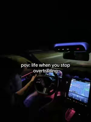 The cover image shows a point-of-view shot from inside a car at night. The driver's hands are visible on the steering wheel, and the dashboard is illuminated. The text overlay reads 'pov: life when you stop overtrading.' The overall composition is dark, with streaks of light suggesting movement.
