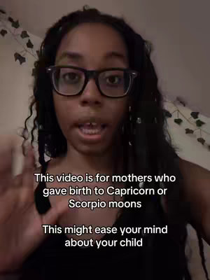 A medium shot shows a young woman with long black hair wearing glasses, speaking directly to the camera. She is indoors, with a soft light illuminating her face. Text overlays are placed below her.