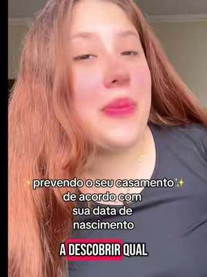 A woman with long red hair is looking at the camera. Text overlays are present on the image.