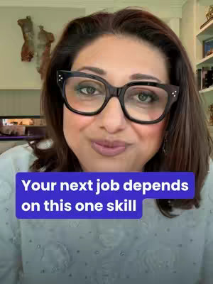 The cover image shows a woman with dark brown hair and black-framed glasses. She's smiling slightly and looking towards the camera. Overlayed on top is a blue rectangular text box.