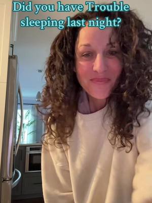 The cover image shows a woman with curly brown hair smiling at the camera. Above her, text reads: "Did you have trouble sleeping last night?" The background appears domestic with glimpses of a kitchen and stainless steel appliances.