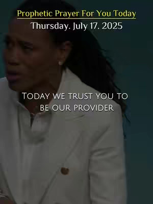 A woman in a white blazer looks to the side, with text overlays announcing a prophetic prayer for the day.