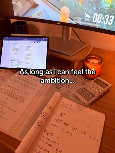 A desk setup shows a tablet displaying notes, a monitor with a timer, a calculator, a candle, and open books with equations. A text overlay adds motivation.