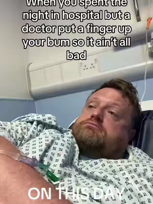 A man in a hospital gown lies in a hospital bed, appearing pensive. Text overlays convey humor related to a hospital stay. The overall tone is a mix of seriousness and irony.