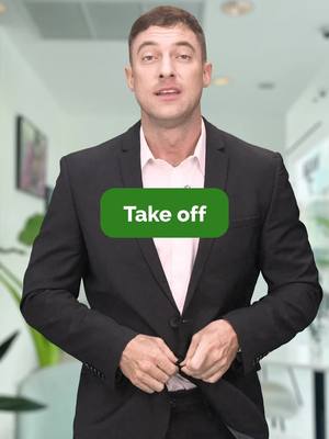 A man in a black suit with a green rectangular text overlay that says 'Take off'.