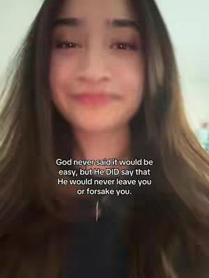 A selfie-style video, the cover shows a young woman with long brown hair. Her face is centered, with a slightly blurred background. The text overlay is in the bottom portion of the frame, conveying a message about faith.