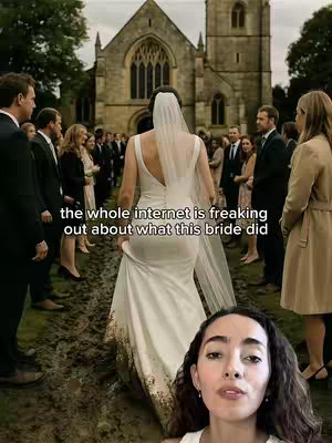 The image features a bride in a white wedding dress walking away from the camera. She is in a muddy area, surrounded by people in formal attire, likely at a wedding ceremony. In the background is a stone building with archways. The color palette is muted, with natural tones dominating. A woman is featured in the foreground with her face partially visible.