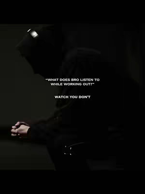 A dark, moody image featuring a person in a hooded jacket, silhouetted against a shadowed backdrop. Text overlayed on the image presents a question about workout music and a response.