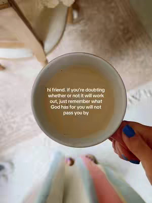 The cover image features a top-down view with a hand holding a white teacup with pale yellow liquid. Text is overlaid on the teacup. The image has a warm, soft focus with a blurred background.