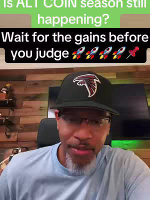 A man wearing a black Atlanta Falcons hat and glasses, with a light blue shirt, is the focus. Text overlays at the top ask about altcoin season with a green background, while the bottom shows rocket emojis and text about gains.
