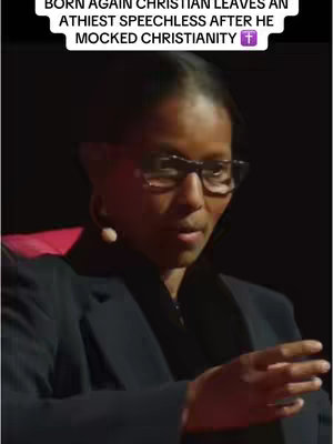 A woman in glasses speaking at an event, with a title superimposed on a dark background.