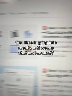 A blurry, out-of-focus image of a computer screen, likely capturing a website or document. The focus is on the overlayed text in the center, which appears in white, readable font against the blurred background. The overall composition is simple with the primary focus on the overlay text. Color tones are light, mainly shades of white and gray from the screen.