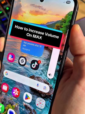 A person holding a smartphone displaying a homescreen with various app icons. A banner overlay indicates the video's content: Tips on increasing volume. The background shows a landscape with a sunset.