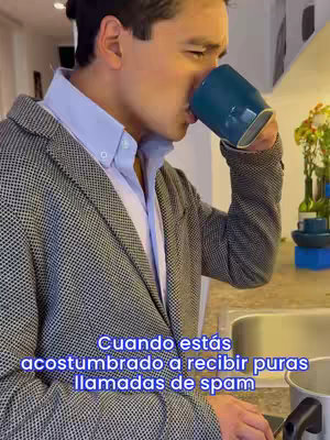 A man in a blazer sips from a teal mug. The scene is lit by natural light, suggesting a casual, indoor setting. Text overlays on the lower part of the image.