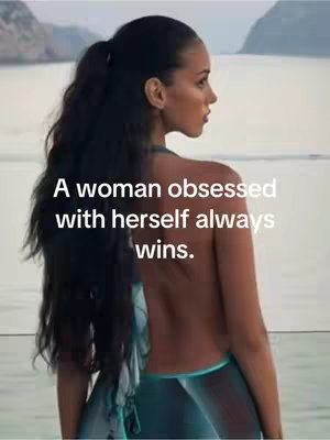 A woman is seen in profile, looking towards the right. She has dark hair pulled back into a ponytail. The woman appears to be standing near water. She is wearing a revealing top that is partially visible. Text overlayed on the image reads: A woman obsessed with herself always wins.