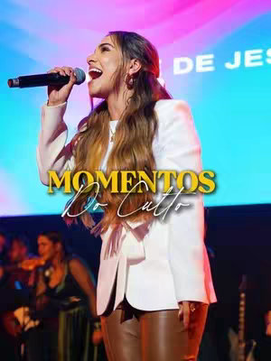 The cover image features a woman singing into a microphone, with the words 'Momentos Do Culto' overlaid on the image. She is dressed in a white blazer over an off-white top with brown leather pants. The background is a blurred stage with people out of focus. The lighting is warm, focusing on the singer's face, which is open and expressive.