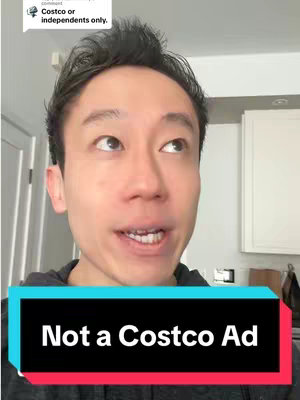 A man with short dark hair looks up and to his right, with open mouth. He is wearing a black hoodie. A colored rectangular text box with rounded corners is at the bottom of the frame, with white text that reads: Not a Costco Ad