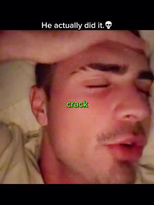 A close-up shot of a man in bed. Text overlay reads 'He actually did it.' beside a skull emoji. The word 'crack' is in green across his cheek.