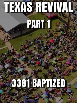 An aerial shot of a large outdoor event, likely a baptism. A large white tent is on the left, and a large crowd of people is gathered on the grass in the middle of the frame, with many holding umbrellas. White text overlays are 'TEXAS REVIVAL', 'PART 1', and '3381 BAPTIZED'.
