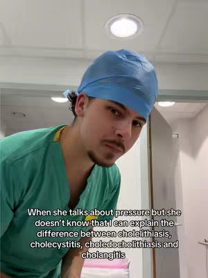A man wearing a blue surgical cap and green scrubs looks directly at the camera. He stands in what appears to be a medical setting based on the background with overhead lights. Text is overlaid at the bottom of the visual.