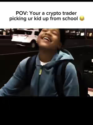 The cover image features a young Black man smiling broadly, his face angled upwards, suggesting laughter or joy. He's wearing a blue hooded sweatshirt, and a dark backpack is visible on his shoulders. In the background is a blurry image of a white SUV, suggesting an outdoor setting, possibly a school pick-up area. Text overlayed atop the image reads 'POV: Your a crypto trader picking ur kid up from school 😂'.