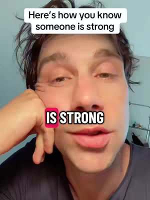 A close-up shot shows a person looking at the camera with a slightly tilted head. Above the person is a text overlay that reads 'Here's how you know someone is strong'. Below his face a red banner reads 'IS STRONG'.