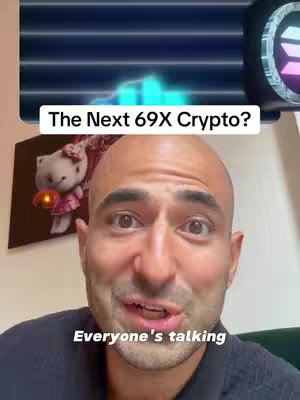 A man with a bald head is filming a video. The background has a wall with a poster. A text box at the top says 'The Next 69X Crypto?'. There is a neon logo on the right side of the video and underneath is text with an animated graph in the background. Below the overlay, there is a person with a smile looking towards the camera, with text at the base of the video: 'Everyone's talking'.