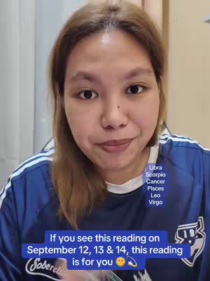 A woman with light brown hair, wearing a blue and white athletic shirt, looks towards the camera with a slight smile. Text overlays on the image lists zodiac signs and a call to action regarding a reading on specific dates.