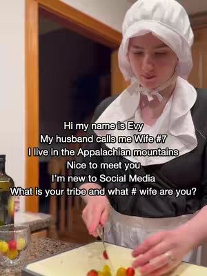 A woman in a white bonnet and historical dress is in a kitchen. Text overlays describe her and her situation.