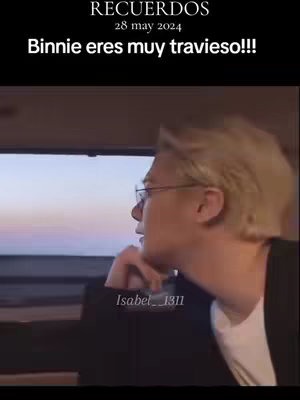 The cover image shows a man with blonde hair and glasses looking out a window on a car ride, with a scenic view of a colorful sky. Overlaying text creates the title and a date.