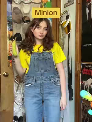 A young woman in a yellow shirt and denim overalls poses in front of a cluttered door. A yellow rectangular text overlay reads "Minion". She holds a banana.
